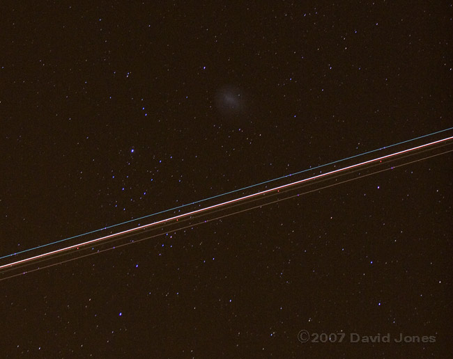 An aircraft passes Comet Holmes - 2