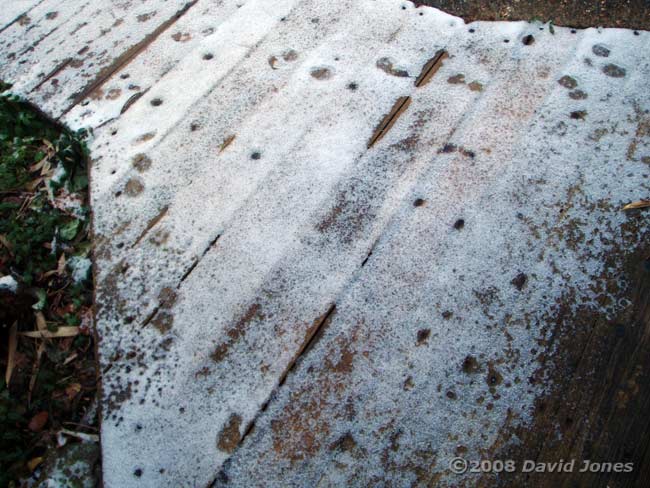 Veneer of snow on our decking