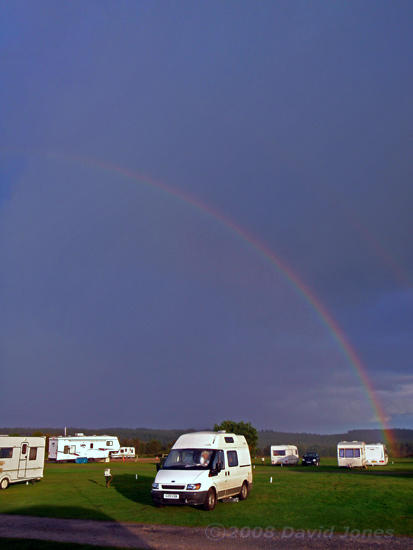 Squall trails a rainbow as it passes over Exeter Racecourse