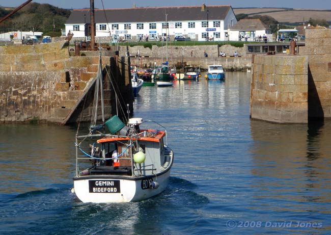Fishing boat about to enter the inner harbour at Porthleven