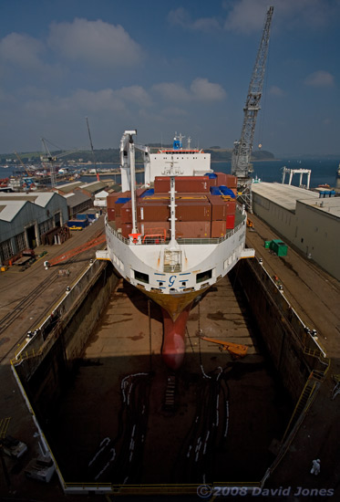 A container ship in dry dock