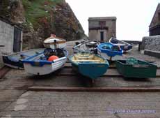Fishing boats in Polpeor Cove - hauled up for bad weather