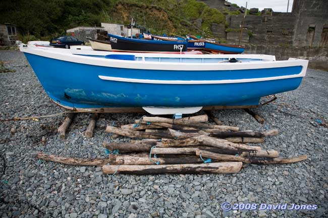 Porthoustock Cove - fishing boat with log rollers