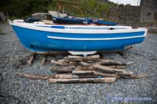 Porthoustock Cove - fishing boat with log rollers