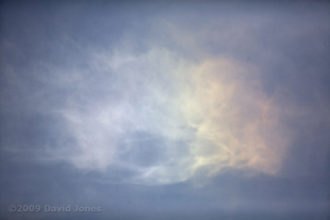 Rainbow colours in a cloud just before dusk