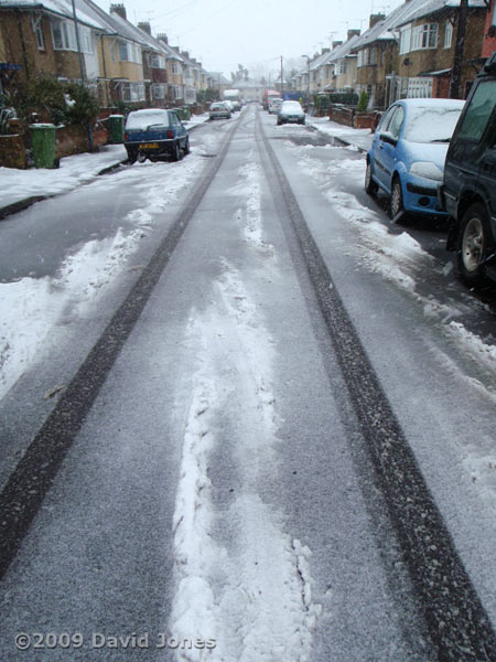 Snow falling at lunchtime - our road